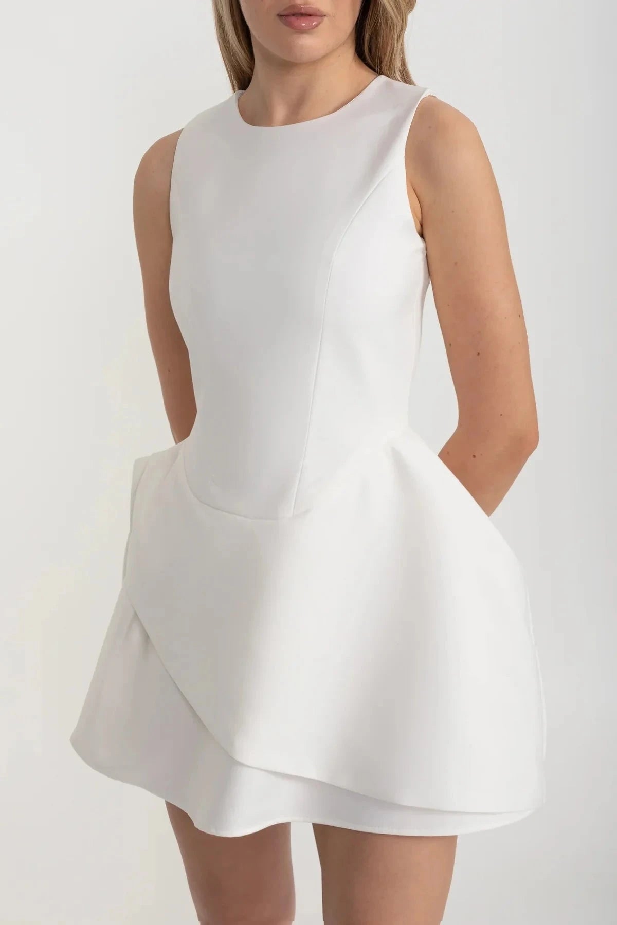 Contemporary Sleeveless Dress With Fitted Bodice And Asymmetrical Skirt - White