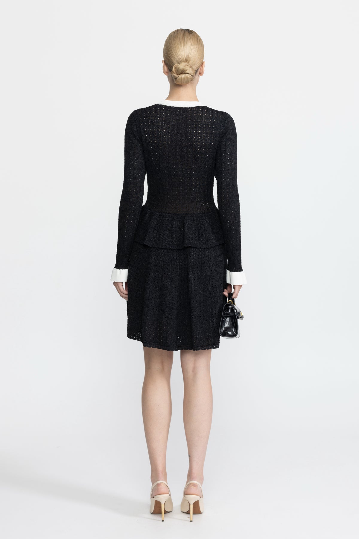 Robe mini péplum en maille pointelle à boutons dorés - Noir