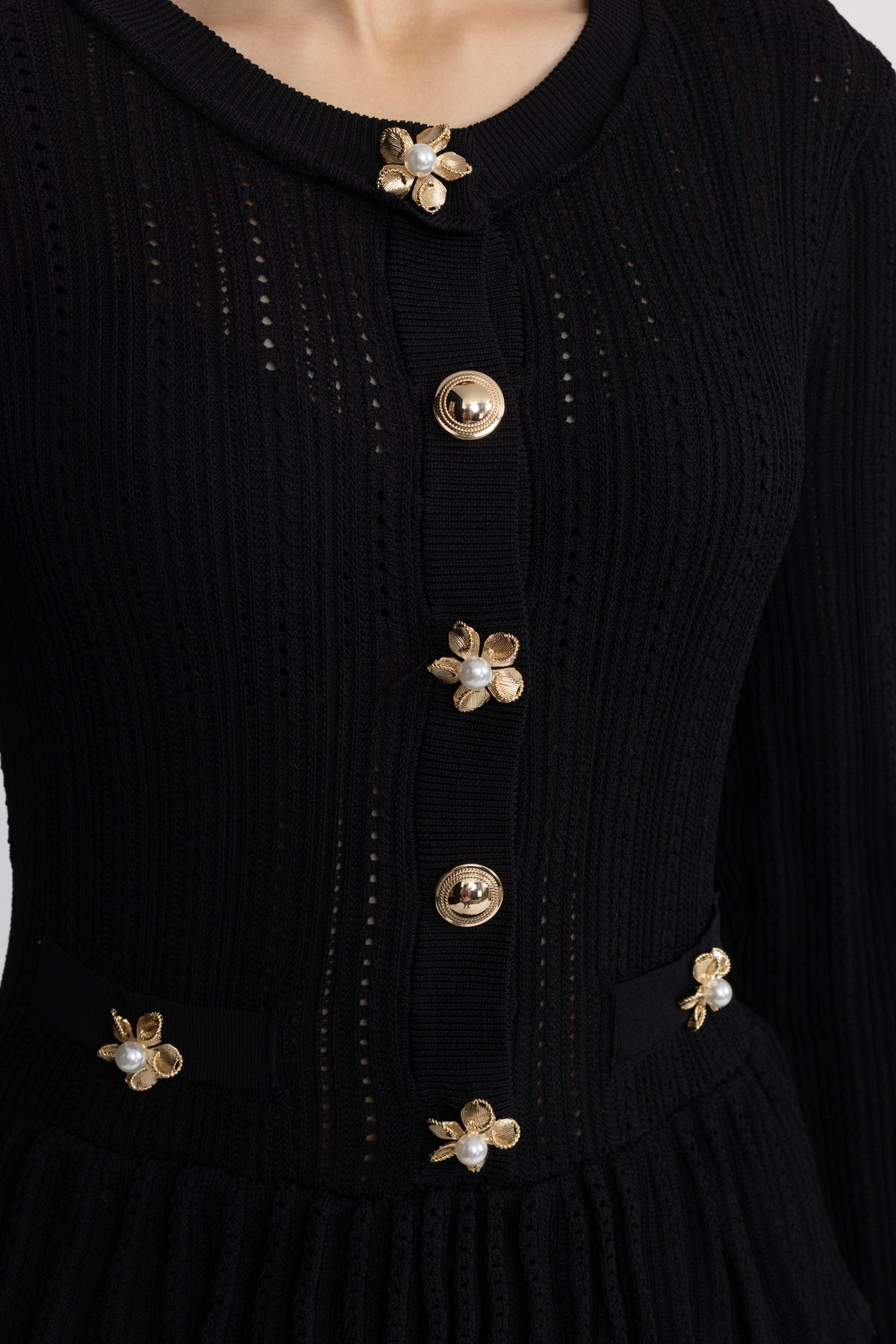 Mini-robe péplum en maille pointelle à boutons fleur - Noir