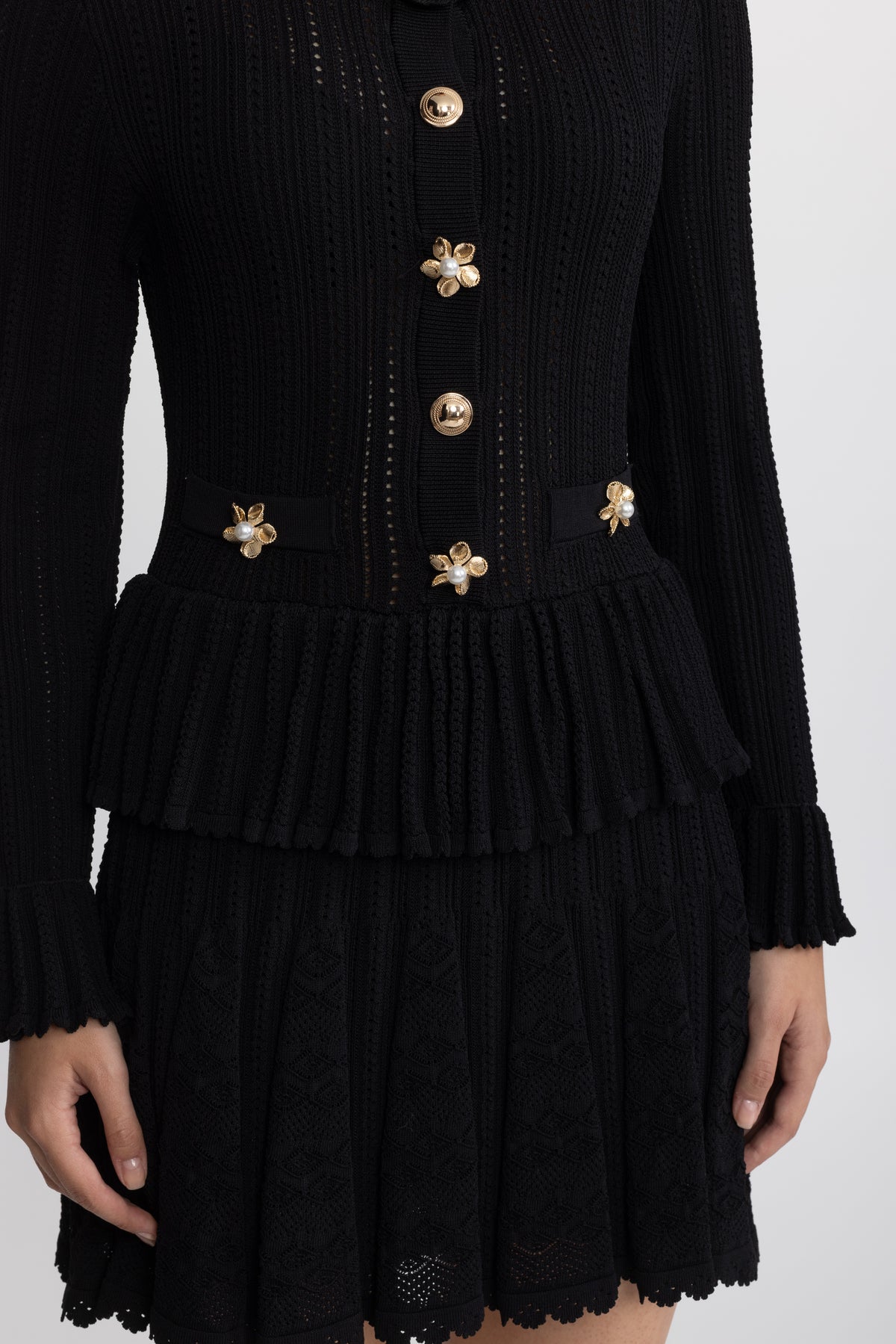 Mini-robe péplum en maille pointelle à boutons fleur - Noir