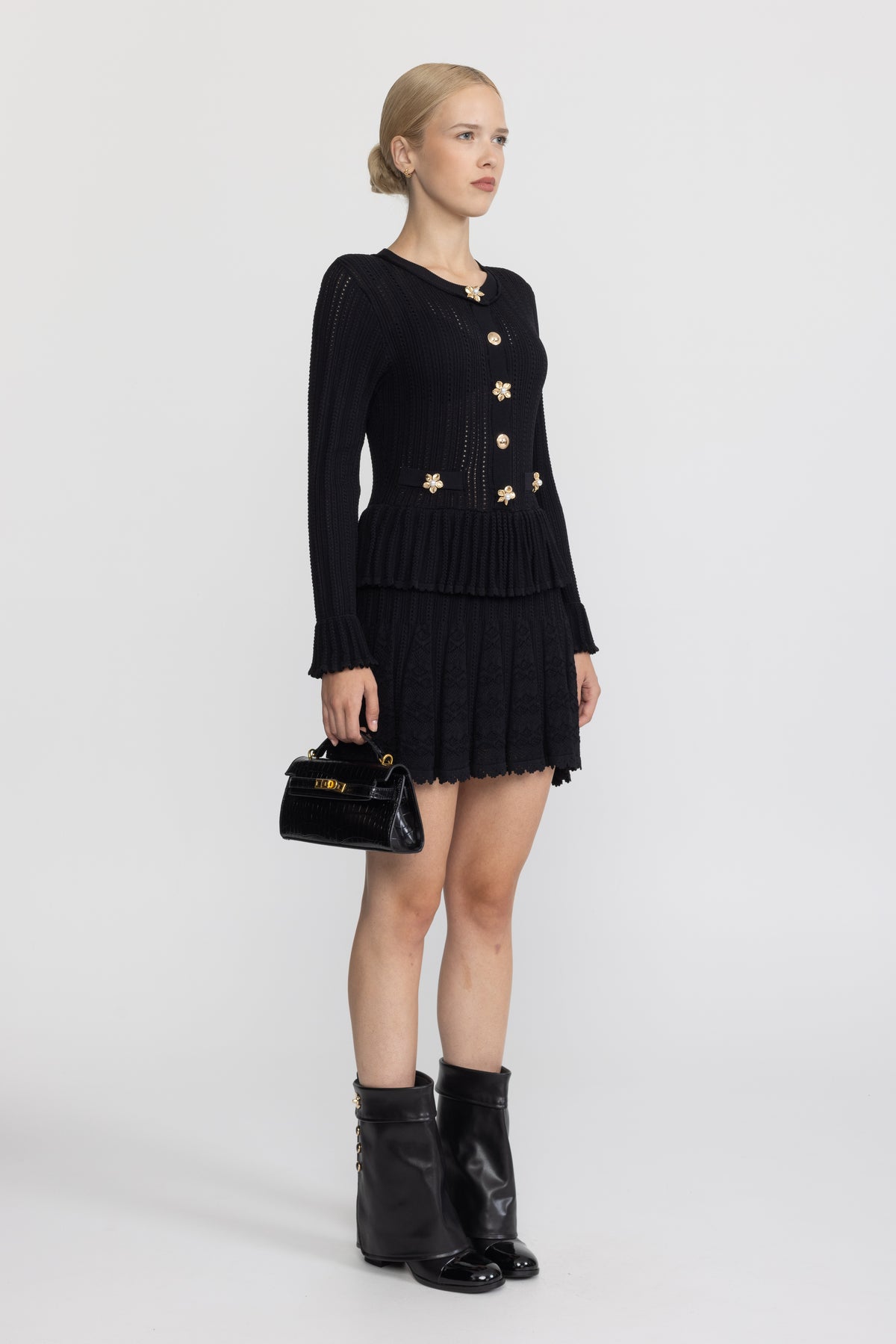 Mini-robe péplum en maille pointelle à boutons fleur - Noir