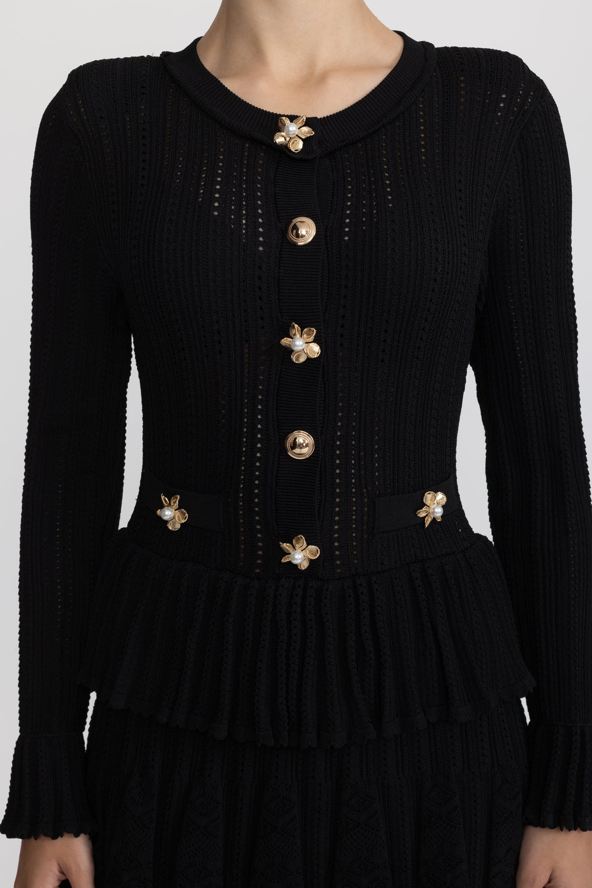 Mini-robe péplum en maille pointelle à boutons fleur - Noir 