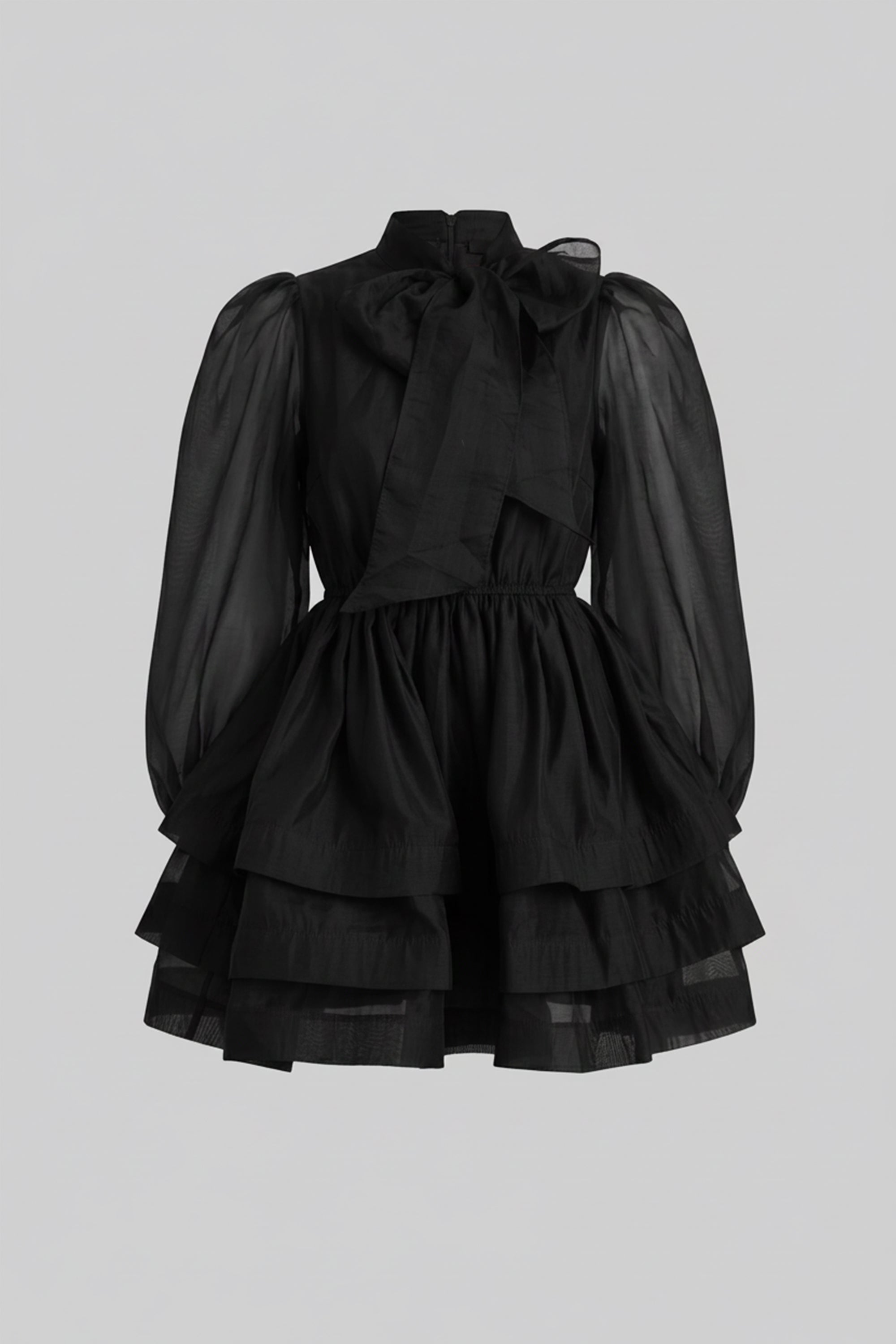 Mini-robe noire à col montant, manches bouffantes, jupe à volants superposés et nœud 